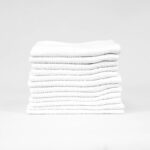 Stack of 12x12 Economy White Washcloths in Bulk