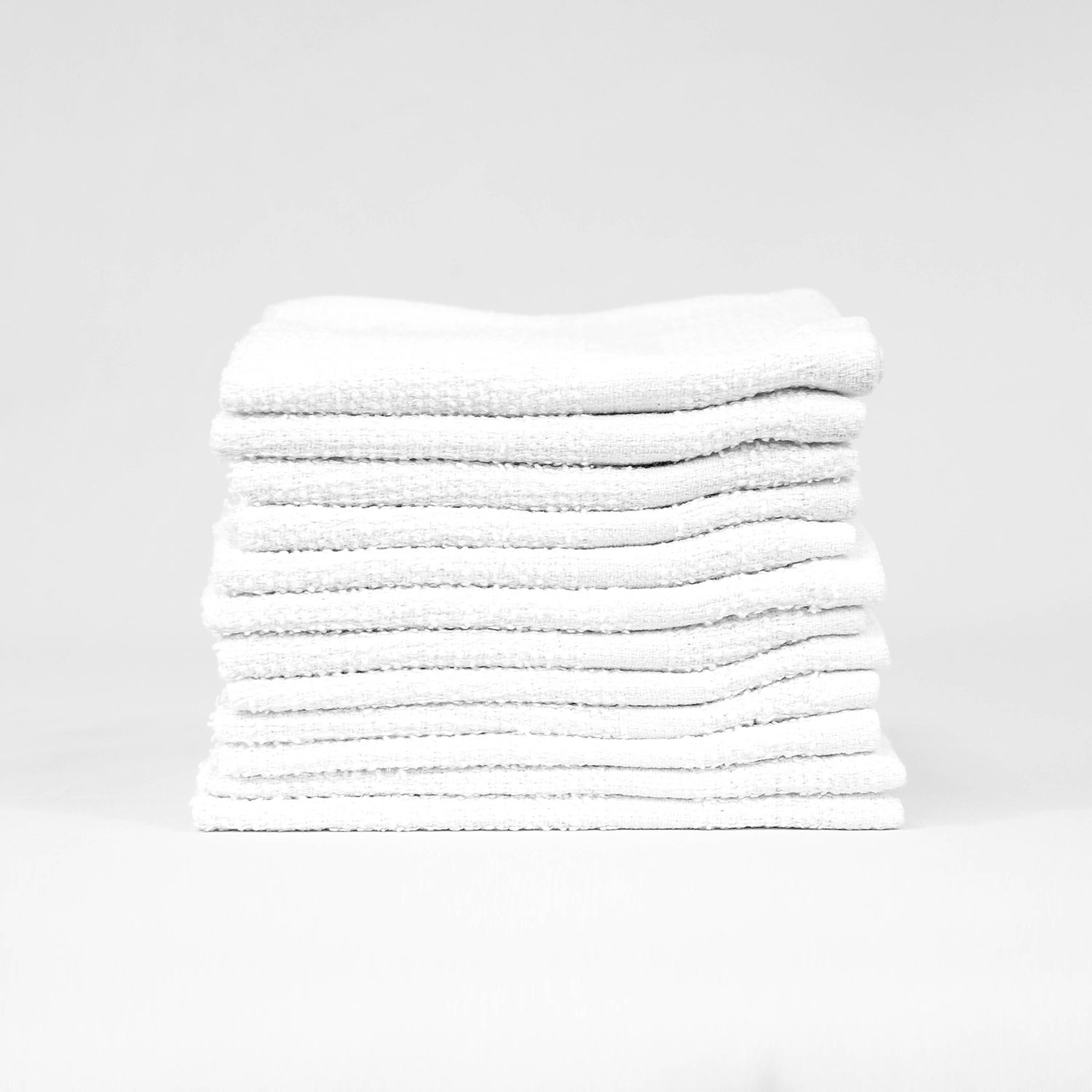 Stack of 12x12 Economy White Washcloths in Bulk