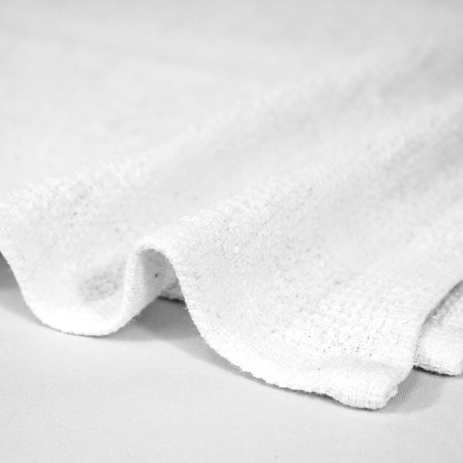 Closeup of 12x12 Economy White Washcloths in Bulk