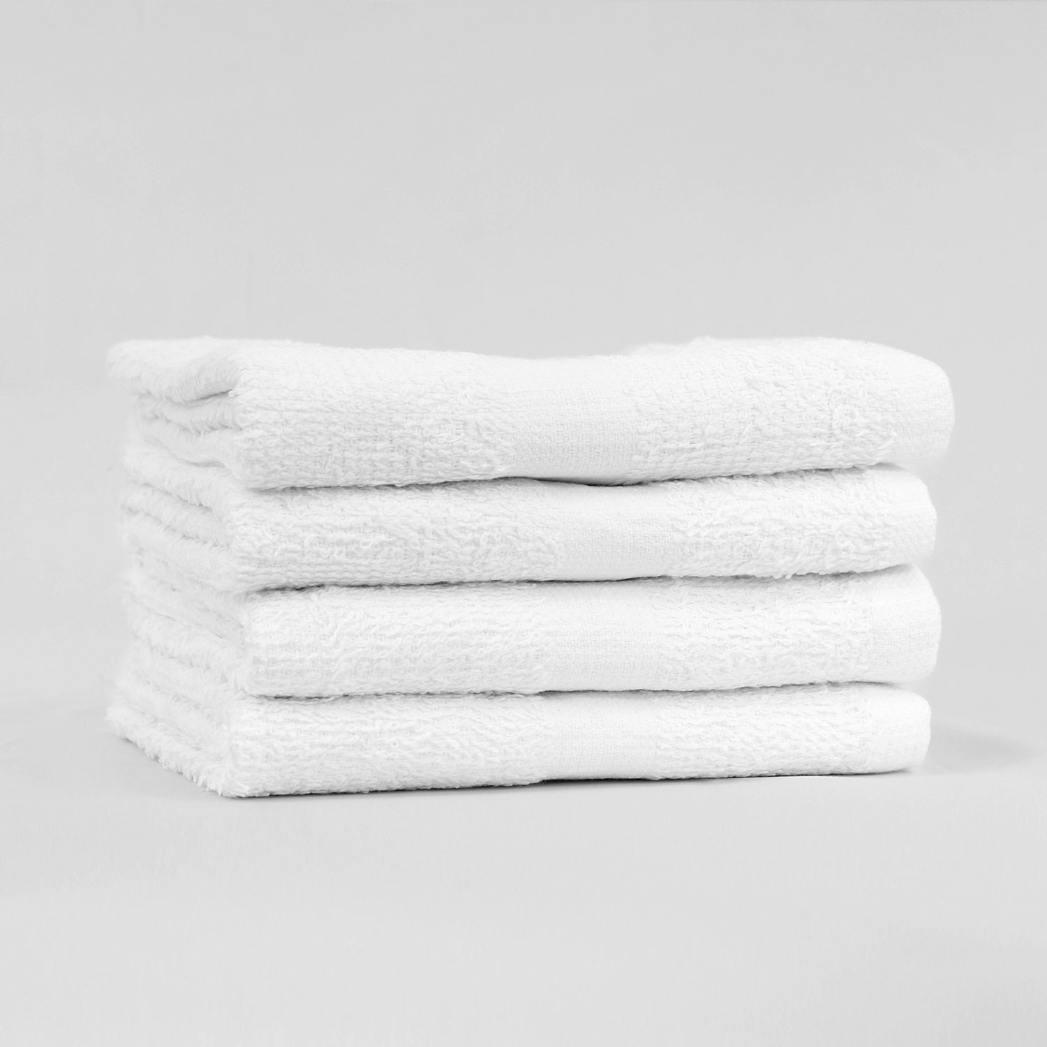 Stack of 15x25 Economy White Hand Towels in Bulk