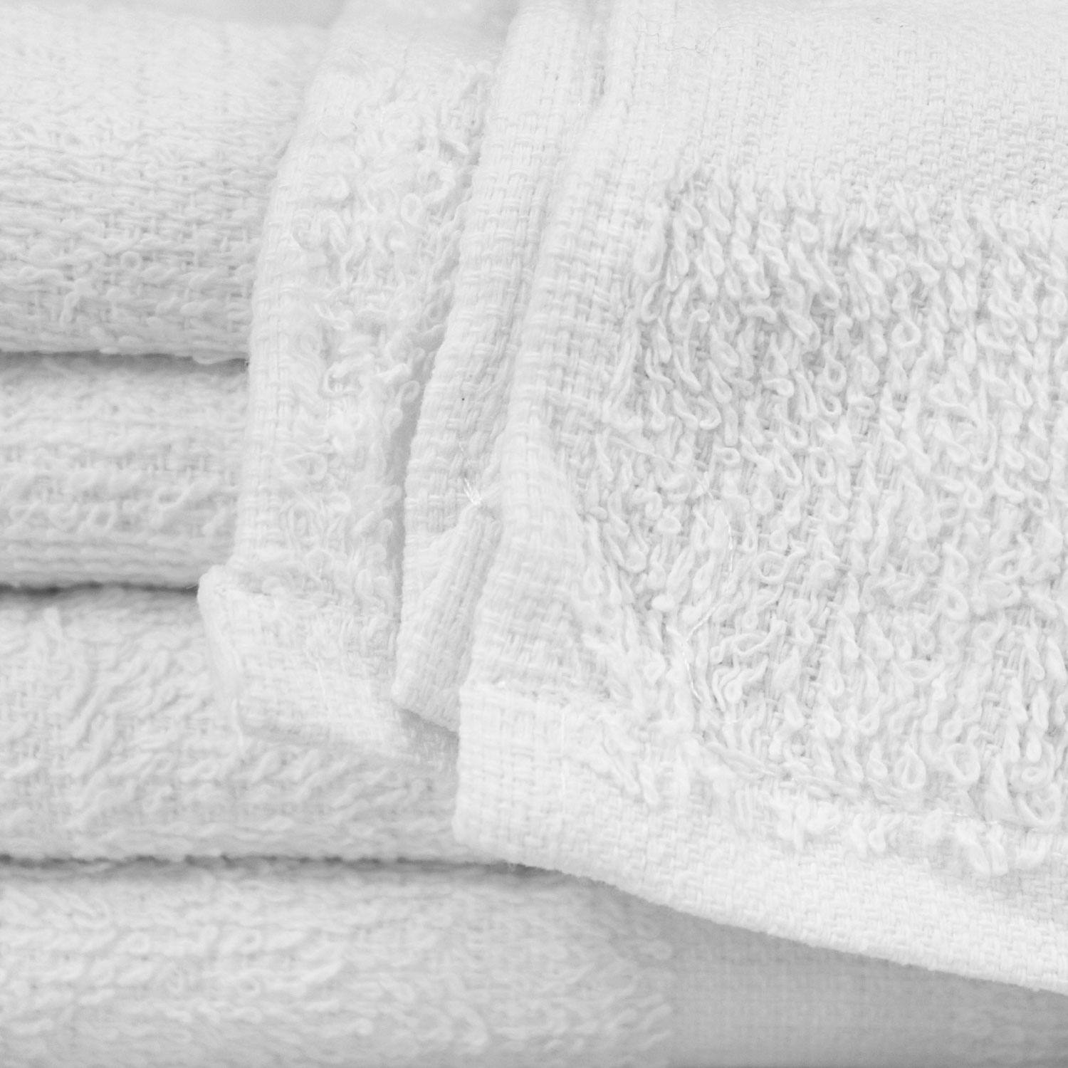 Closeup of 15x25 Economy White Hand Towels in Bulk