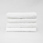 Stack of 16x27 Economy White Hand Towels