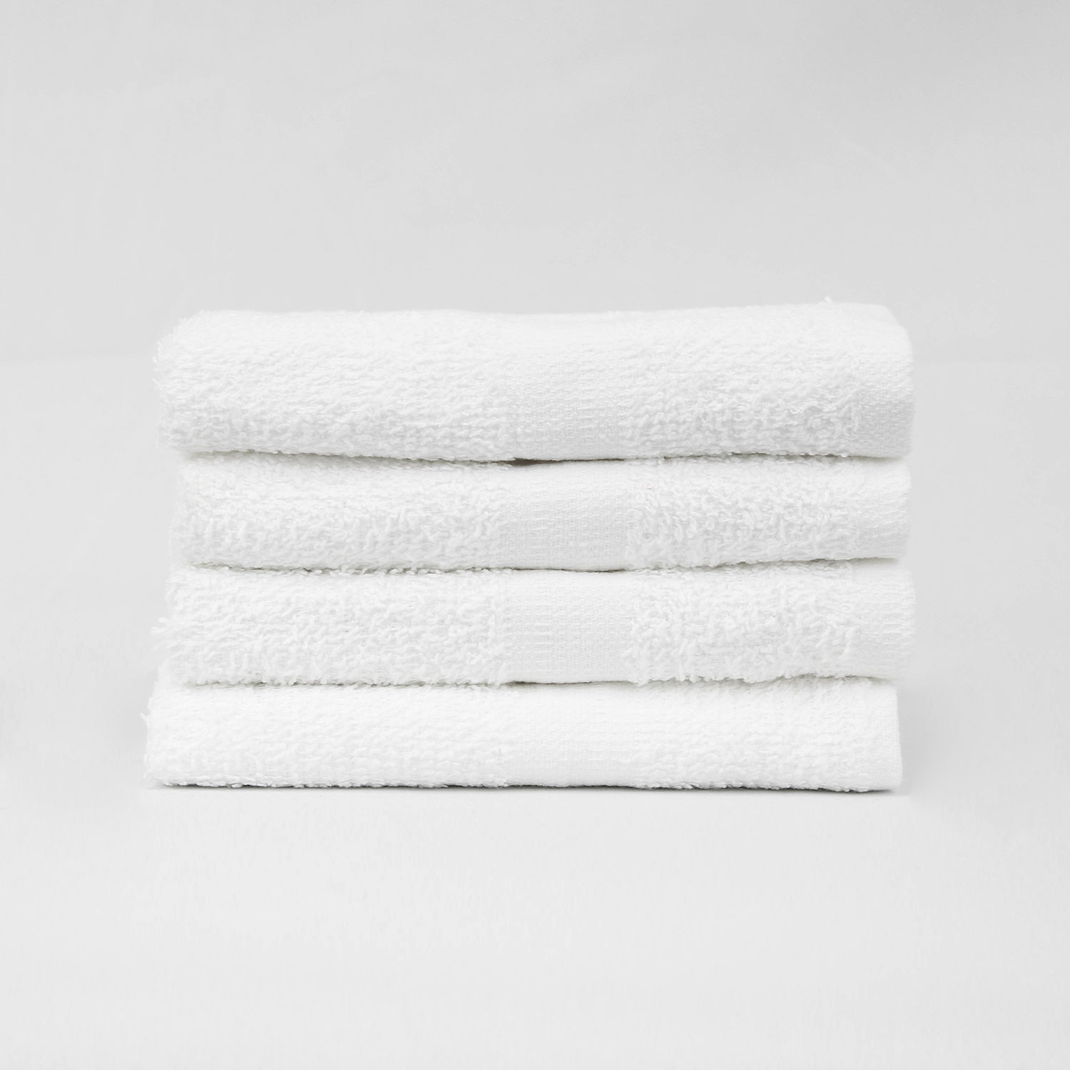 Stack of 16x27 Economy White Hand Towels