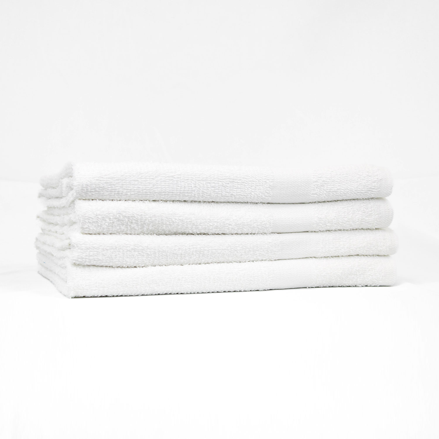 Stack of 22x44 Economy White Gym Towels