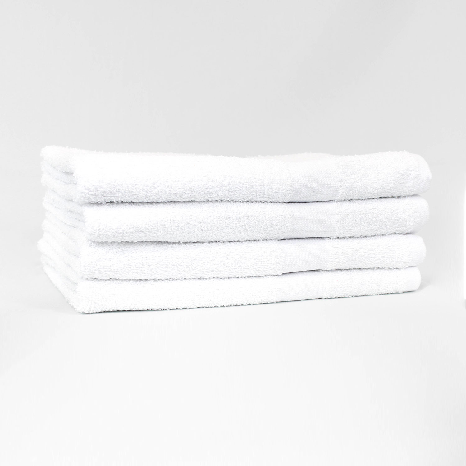 Stack of 24x48 Economy White Bath Shower Towels