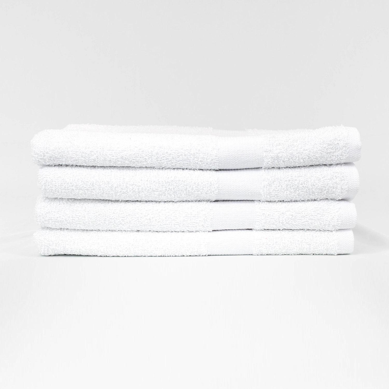 Stack of 24x48 Economy White Bath Shower Towels