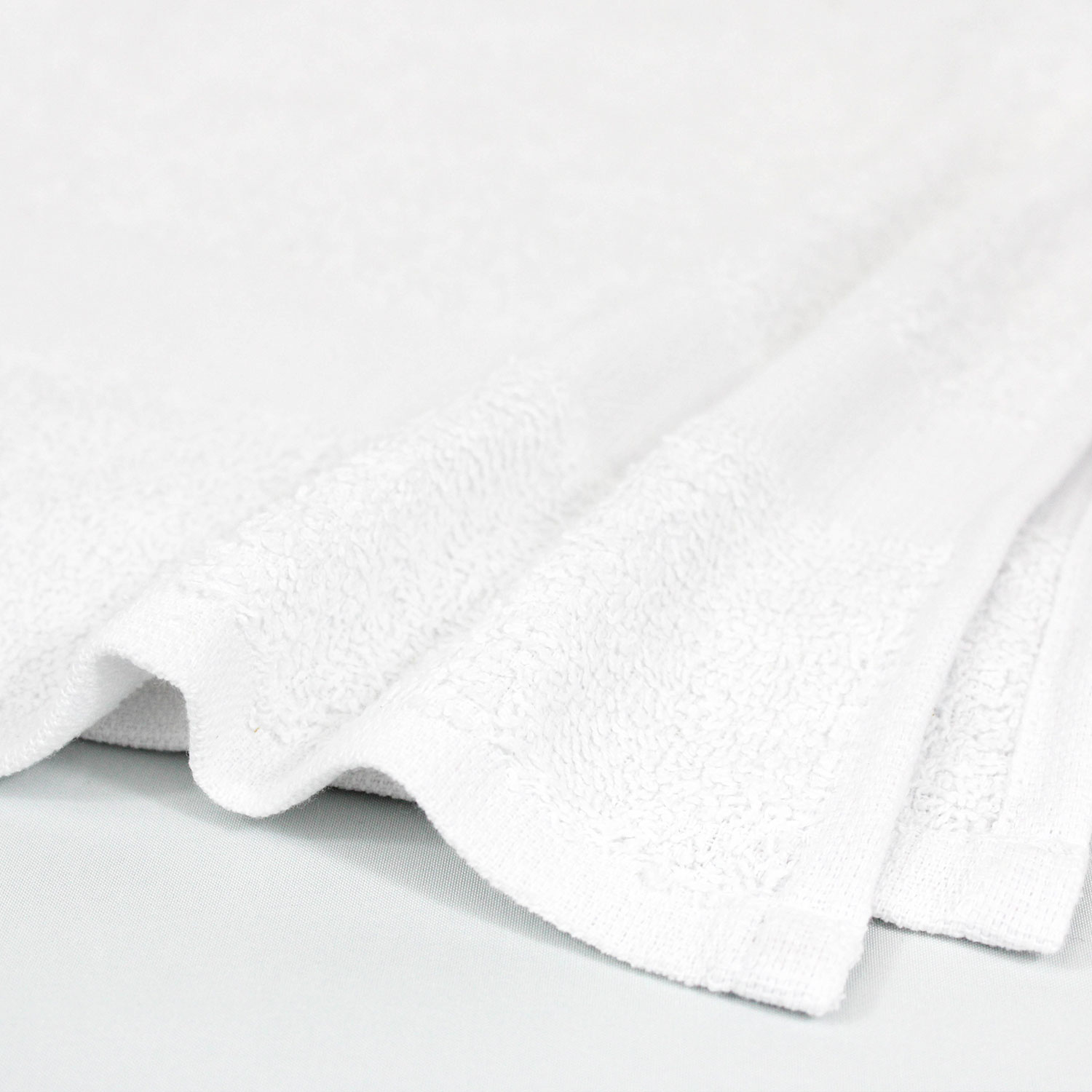 Closeup of 24x48 Economy White Bath Shower Towels