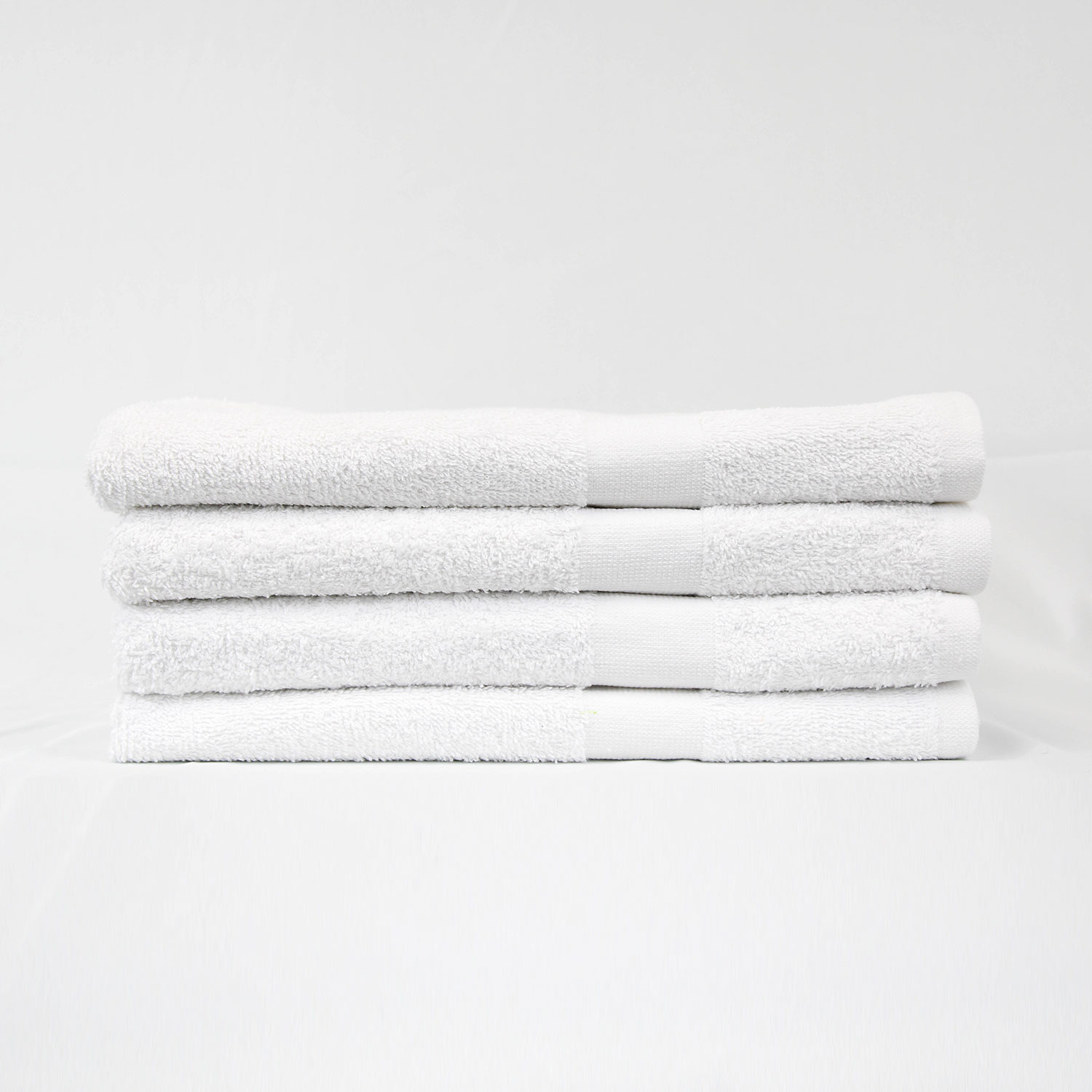 Stack of 24x50 White Bath Towels 10.50lb